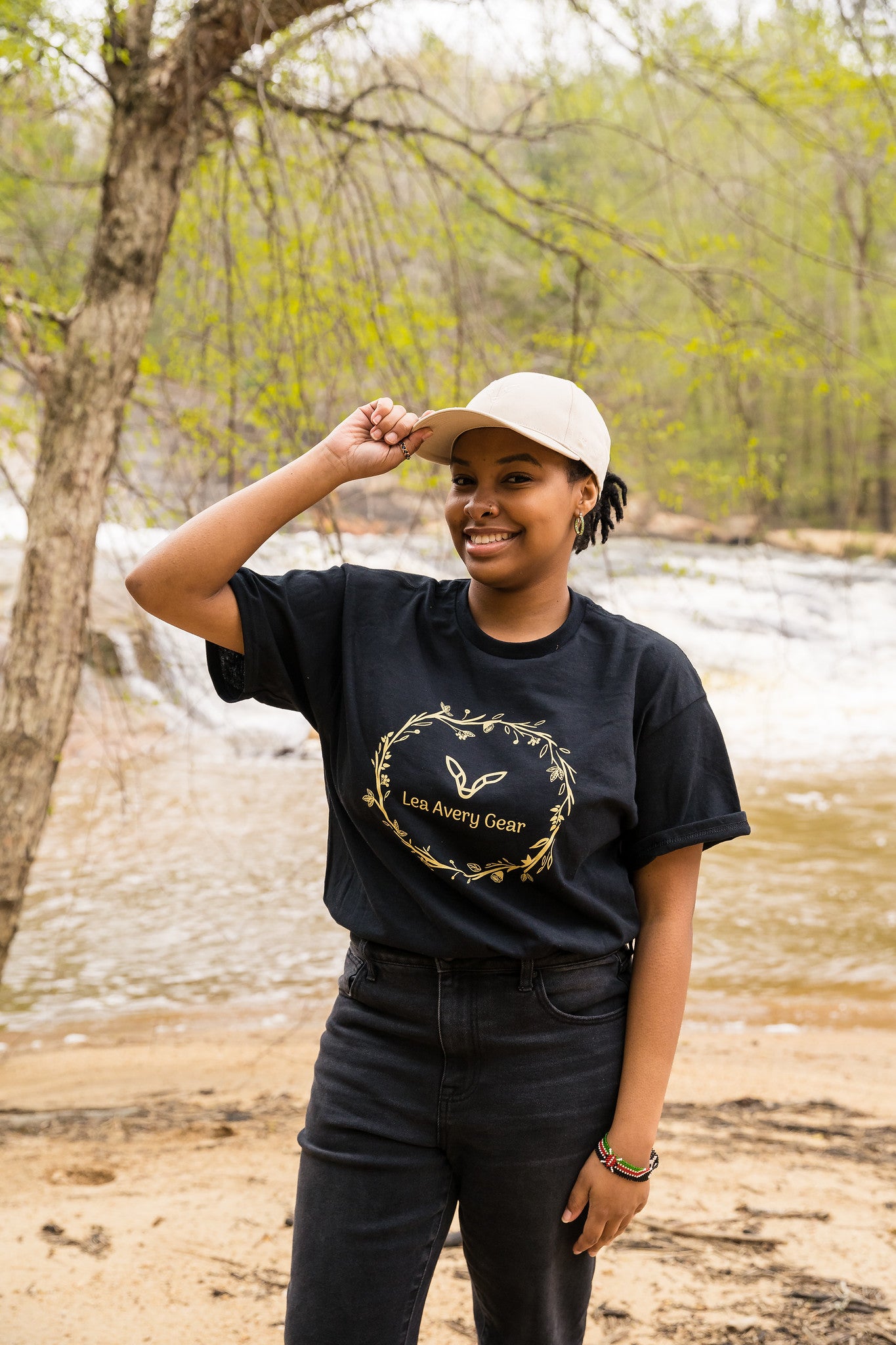 Girl wearing floral logo t-shirt and hat