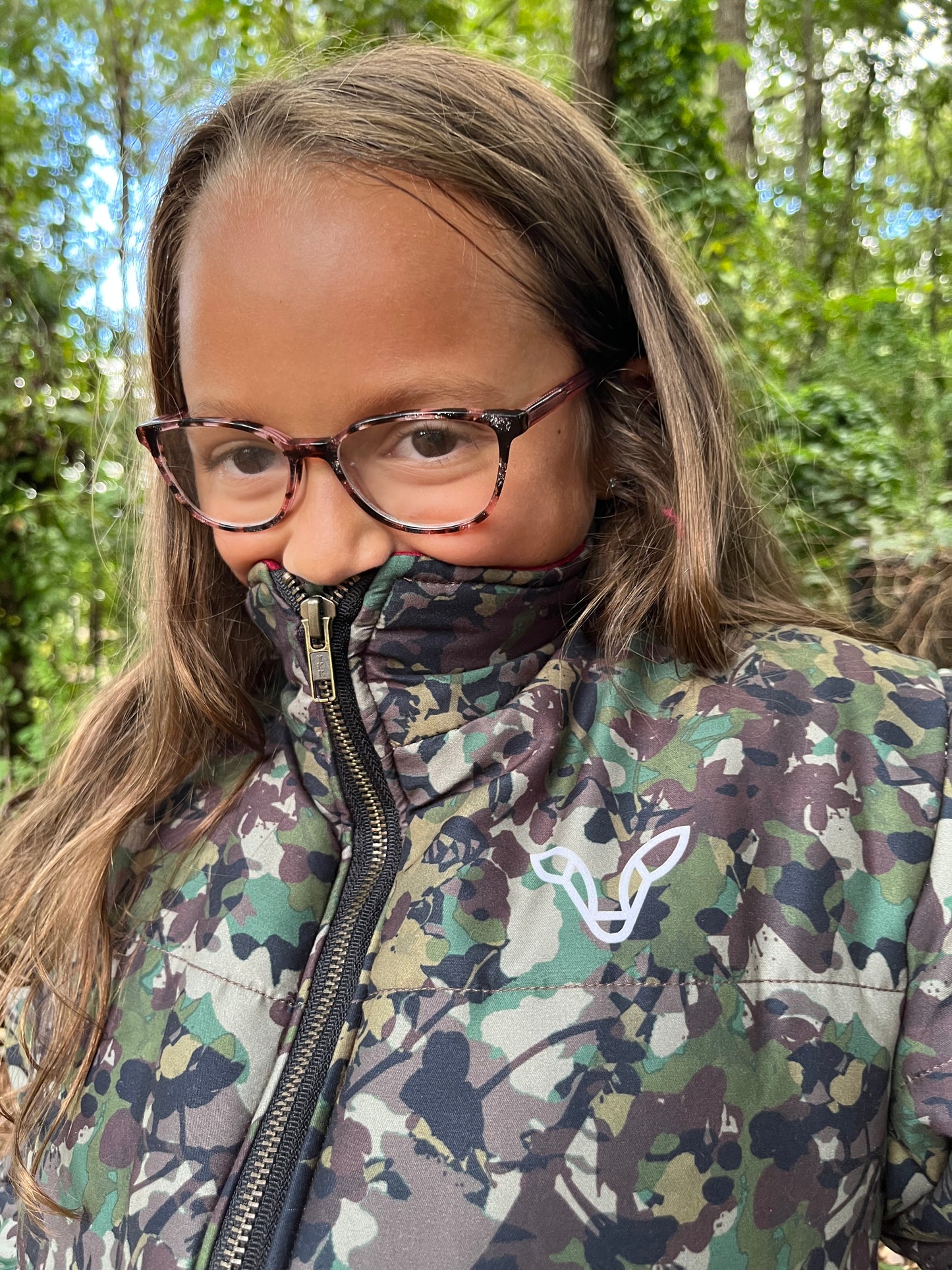 Girl wearing fleece lined camo hunting jacket